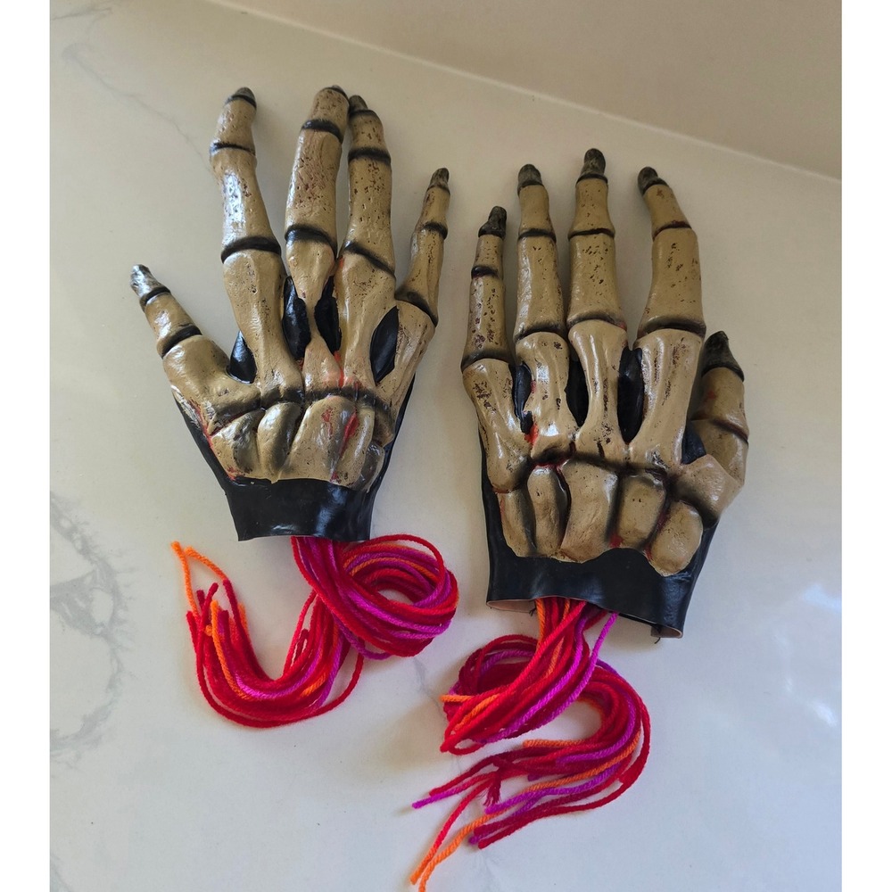 Skeleton Hand Prop Pair Realistic Bone Finish with Yarn Fringe Halloween Decor